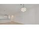 Dining room with chandelier and kitchen pass-through at 5152 Bay Isle Cir, Clearwater, FL 33760