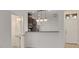 Open kitchen with breakfast bar and views to the entryway at 5152 Bay Isle Cir, Clearwater, FL 33760