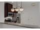 Modern kitchen with dark cabinets and granite counters at 5152 Bay Isle Cir, Clearwater, FL 33760