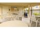 Community pool area with tables, chairs, and restrooms at 5152 Bay Isle Cir, Clearwater, FL 33760