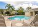 Relaxing community pool area with patio furniture at 5152 Bay Isle Cir, Clearwater, FL 33760