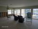 Dining room with water view and renovation in progress at 565 Crystal Dr, Madeira Beach, FL 33708