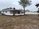 Backyard of a newly renovated single story home with screened porch at 5706 23Rd W St, Bradenton, FL 34207