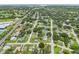 Aerial view of residential neighborhood, showcasing homes, landscaping, and nearby amenities at 6108 Pershing Ne St, St Petersburg, FL 33703