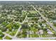 Aerial view of neighborhood with homes and mature trees at 6108 Pershing Ne St, St Petersburg, FL 33703