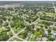 Wide aerial view of a residential neighborhood near a larger city at 6108 Pershing Ne St, St Petersburg, FL 33703