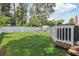 Backyard with deck, shed, and grassy area at 6108 Pershing Ne St, St Petersburg, FL 33703
