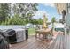 Deck with patio furniture, grill, and storage shed at 6108 Pershing Ne St, St Petersburg, FL 33703