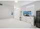 Bright bedroom featuring a king-size bed and built-in storage at 6108 Pershing Ne St, St Petersburg, FL 33703