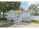 Gray house with stone accents and a well-manicured lawn at 6108 Pershing Ne St, St Petersburg, FL 33703