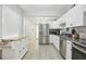 Modern kitchen with stainless steel appliances and white cabinets at 6108 Pershing Ne St, St Petersburg, FL 33703