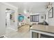 Open living area with a modern media console and gray sectional at 6108 Pershing Ne St, St Petersburg, FL 33703