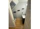 Clean and functional half bathroom with floating shelves and modern vanity at 6603 Osprey Lake Cir, Riverview, FL 33578