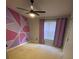 Bedroom with purple accent wall and window coverings at 6603 Osprey Lake Cir, Riverview, FL 33578