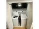 Convenient laundry closet with washer and dryer, and overhead storage at 6603 Osprey Lake Cir, Riverview, FL 33578