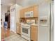 Well-equipped kitchen with white appliances and wood cabinets at 6610 Cambridge Park Dr, Apollo Beach, FL 33572