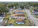 Aerial view of a light blue house with a large backyard and neighboring houses at 704 E Broad St, Tampa, FL 33604