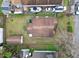 An aerial shot of a light blue house with a backyard and shed at 704 E Broad St, Tampa, FL 33604