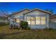 Charming blue house with a well-maintained lawn at 704 E Broad St, Tampa, FL 33604