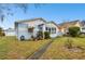 House with a single car garage and a manicured lawn at 704 E Broad St, Tampa, FL 33604