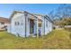 Light blue house exterior with front yard at 704 E Broad St, Tampa, FL 33604