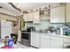 Galley kitchen with stainless steel appliances and wood cabinets at 704 E Broad St, Tampa, FL 33604