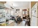 Kitchen with dining area and white cabinetry at 704 E Broad St, Tampa, FL 33604