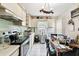 Kitchen features a dining area and white cabinetry at 704 E Broad St, Tampa, FL 33604