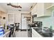 Kitchen with dining area and white cabinetry at 704 E Broad St, Tampa, FL 33604