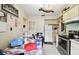 Kitchen with dining area and white cabinetry at 704 E Broad St, Tampa, FL 33604