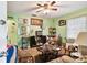 Living room with light green walls and ceiling fan at 704 E Broad St, Tampa, FL 33604