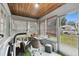 Sunroom with windows and access to backyard at 704 E Broad St, Tampa, FL 33604