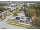 Aerial view showing home with solar panels, pool, and fenced backyard at 7101 69Th N St, Pinellas Park, FL 33781