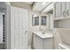 Bathroom with white vanity and tile flooring at 7101 69Th N St, Pinellas Park, FL 33781