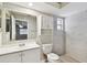 Updated bathroom with white vanity and tile shower at 7101 69Th N St, Pinellas Park, FL 33781