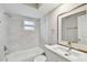 Updated bathroom with a white vanity and grey tile at 7101 69Th N St, Pinellas Park, FL 33781