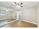 Bedroom with mirrored wall and wood-look floors at 7101 69Th N St, Pinellas Park, FL 33781