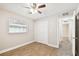 Spacious bedroom with wood-look floors and double doors at 7101 69Th N St, Pinellas Park, FL 33781