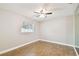 Bedroom with wood-look floors and ceiling fan at 7101 69Th N St, Pinellas Park, FL 33781