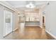 Open dining area, kitchen and living room with wood-look floors at 7101 69Th N St, Pinellas Park, FL 33781