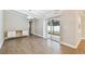 Bright dining area with wood-look tile floors and access to the patio at 7101 69Th N St, Pinellas Park, FL 33781