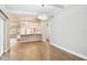 Open concept dining area with kitchen views and wood-look tile floors at 7101 69Th N St, Pinellas Park, FL 33781