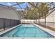 Relax and swim in this screened, enclosed pool with tiled steps at 7101 69Th N St, Pinellas Park, FL 33781
