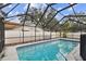 This home features a large, screened, and enclosed pool area at 7101 69Th N St, Pinellas Park, FL 33781