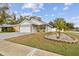 Charming one-story house featuring a two-car garage and manicured lawn at 7101 69Th N St, Pinellas Park, FL 33781