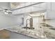 Modern kitchen with granite countertops and a stylish sink fixture at 7101 69Th N St, Pinellas Park, FL 33781