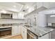 Updated kitchen with stainless steel appliances and granite countertops at 7101 69Th N St, Pinellas Park, FL 33781