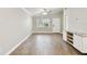 Open concept living room with wood-like tile flooring and ceiling fans at 7101 69Th N St, Pinellas Park, FL 33781