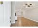 Spacious living area with wood-look tile floors and ceiling fans at 7101 69Th N St, Pinellas Park, FL 33781
