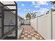 Checkered patio and storage shed in the side yard at 7101 69Th N St, Pinellas Park, FL 33781